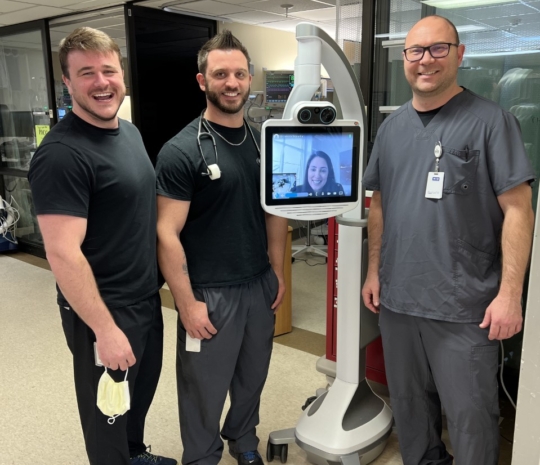 Clinicians with telemedicine cart