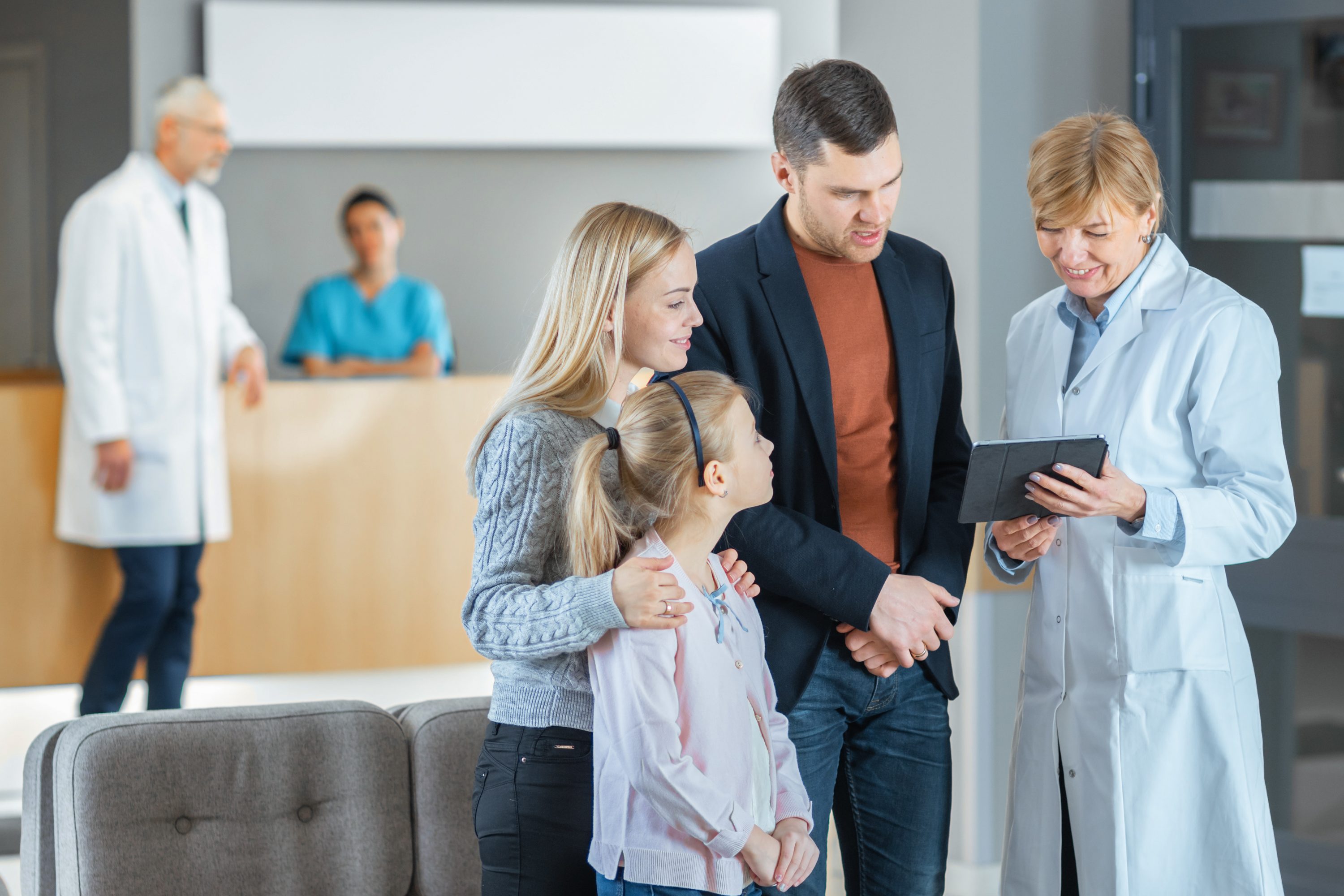 hospital room with patient and family